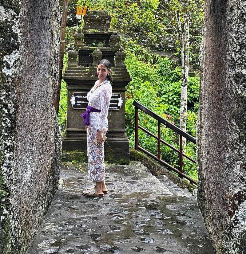 Serena at a stone gateway in Bali