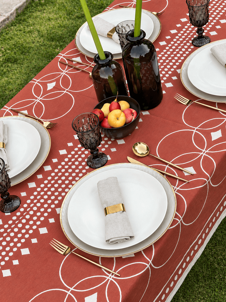 Table set with terracotta KIND printed linens and white plates
